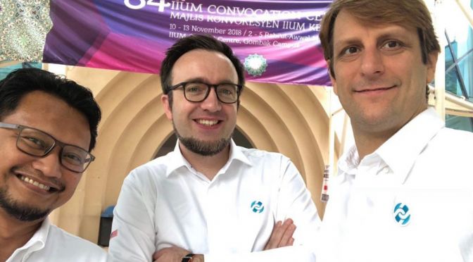 Elmi, Rene, and Jeff wearing white LuxTag shirts, at International Islamic University Malaysia Gombak for IIUM's 35th Convocation Ceremony Event