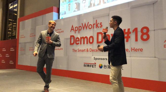 Jeff holding a mike on the stage for AppWorks Demo Day #18