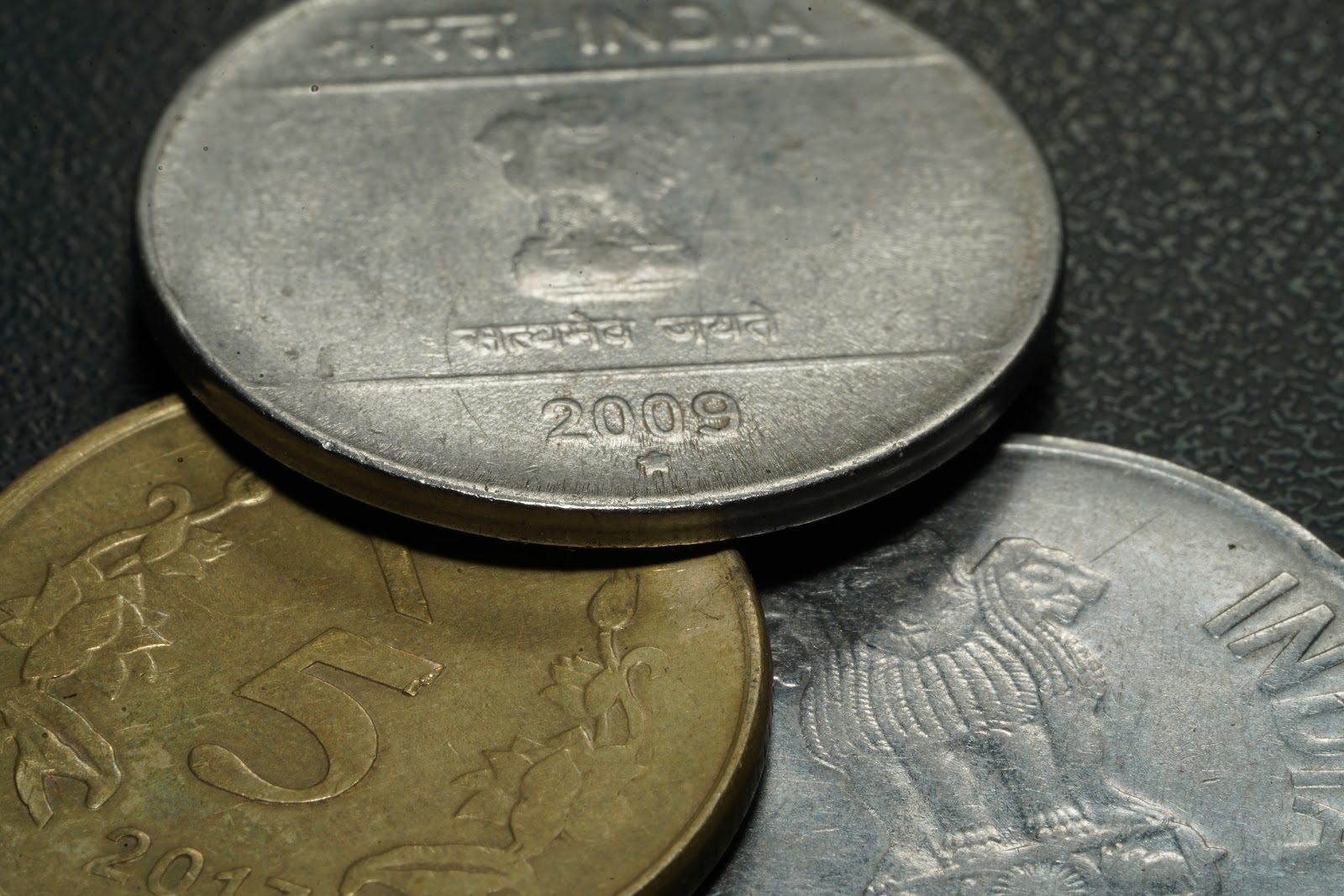 Three Indian coins of different values dated 2009