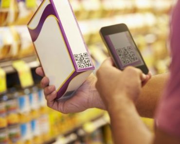 A person scanning QR code by using a smartphone